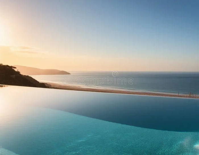 Luxury Infinity Pool Overlooking Beach Stock Image - Image of ...
